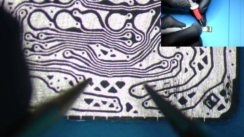 Exposed copper traces of a monolithic microSD card under microscope